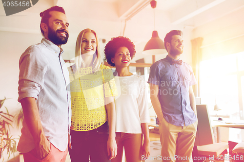 Image of happy creative team in office