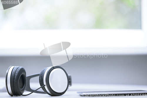 Image of Headphones and digital tablet