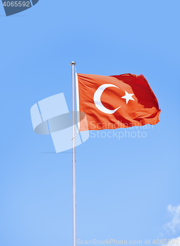 Image of Turkish flag against sky background