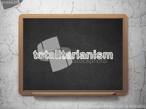 Image of Political concept: Totalitarianism on chalkboard background