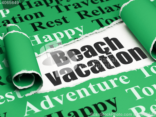 Image of Vacation concept: black text Beach Vacation under the piece of  torn paper
