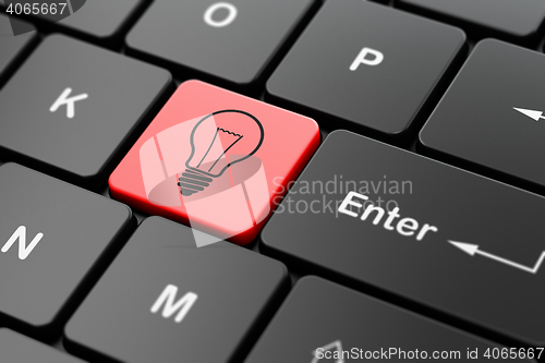 Image of Finance concept: Light Bulb on computer keyboard background