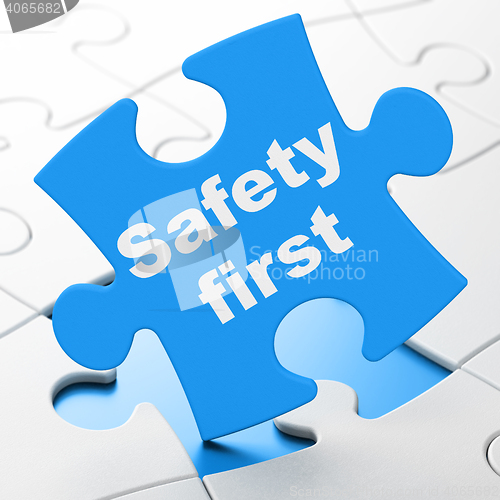 Image of Security concept: Safety First on puzzle background