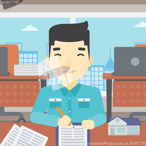 Image of Real estate agent signing contract.