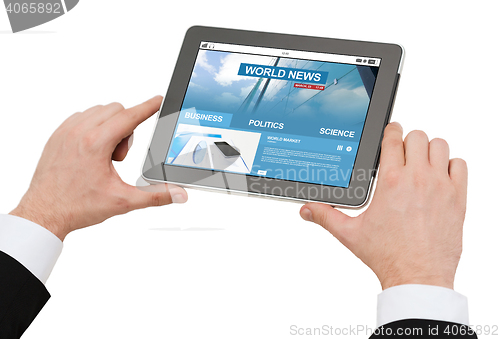 Image of close up of hands with business news on tablet pc