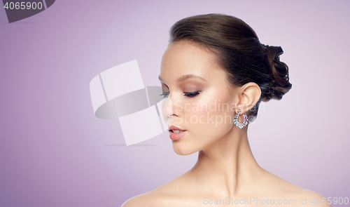 Image of close up of beautiful woman face with earring