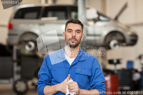 Image of auto mechanic man or smith at car workshop