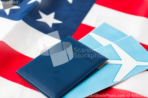 Image of american flag, passport and air tickets