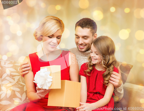 Image of happy family opening gift box