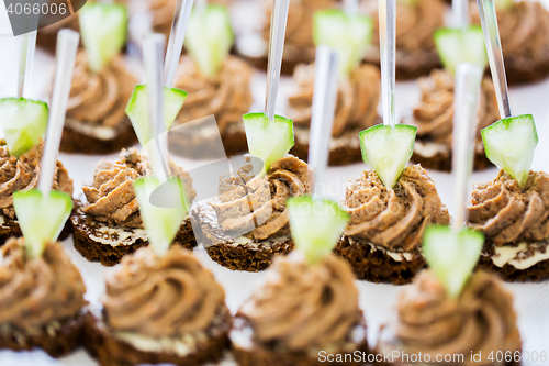 Image of close up of canape with paste on serving tray