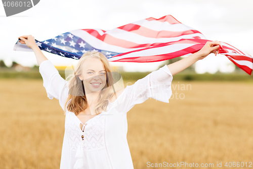 Image of happy woman with american flag on cereal field