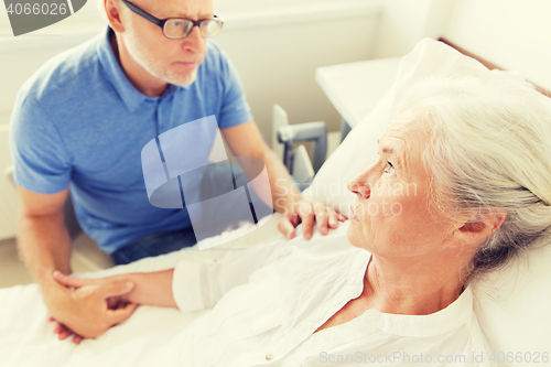 Image of senior couple meeting at hospital ward