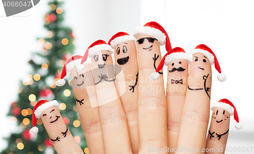 Image of close up of hands and fingers with smiley faces