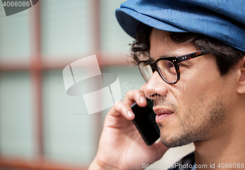 Image of close up of man with smartphone calling on street