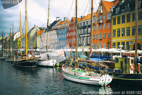 Image of COPENHAGEN, DENMARK - AUGUST 15, 2016: Boats in the docks Nyhavn