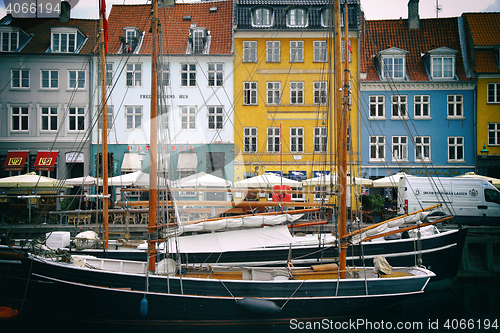 Image of COPENHAGEN, DENMARK - AUGUST 15, 2016: Boats in the docks Nyhavn