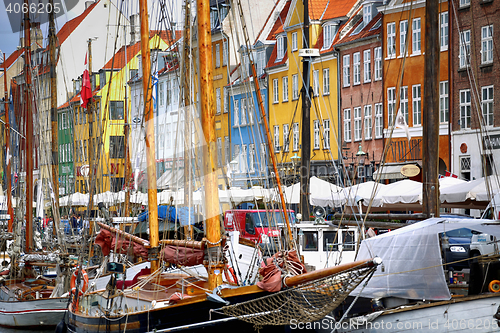 Image of COPENHAGEN, DENMARK - AUGUST 15, 2016: Boats in the docks Nyhavn