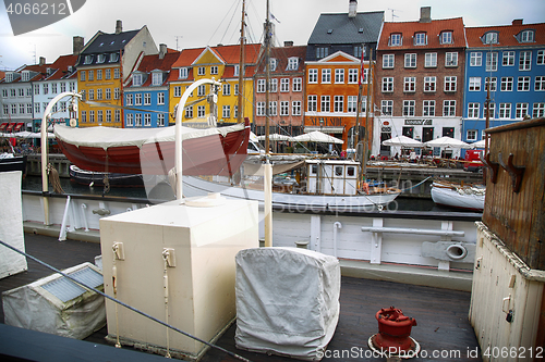 Image of COPENHAGEN, DENMARK - AUGUST 15, 2016: Boats in the docks Nyhavn