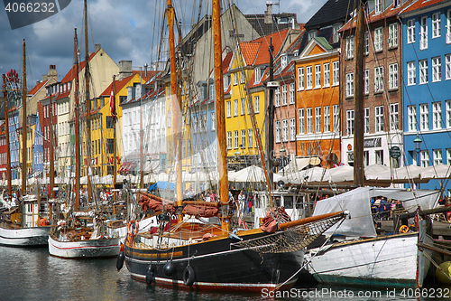 Image of COPENHAGEN, DENMARK - AUGUST 14, 2016: Boats in the docks Nyhavn