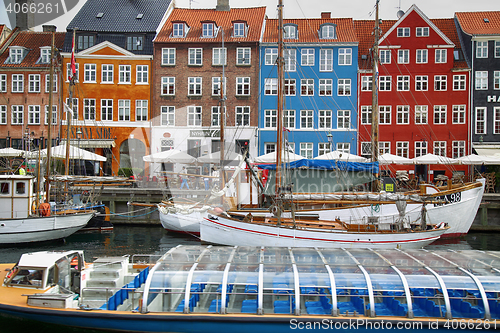 Image of COPENHAGEN, DENMARK - AUGUST 15, 2016: Boats in the docks Nyhavn