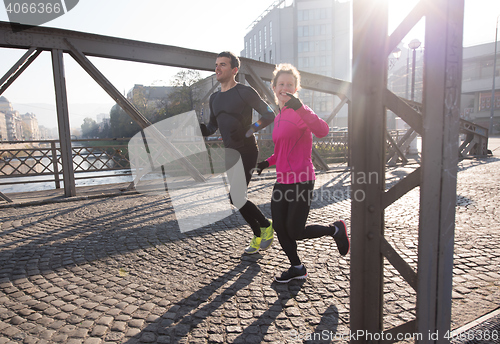 Image of young  couple jogging