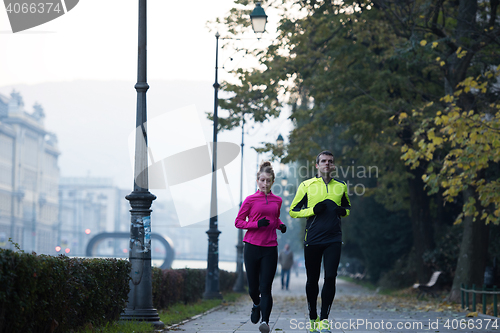 Image of young  couple jogging