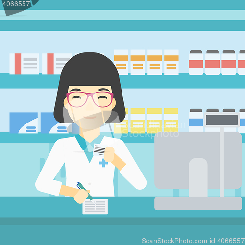Image of Pharmacist writing prescription.