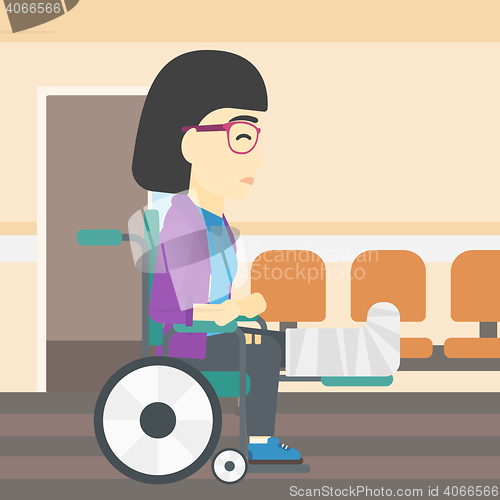 Image of Woman with broken leg sitting in wheelchair.