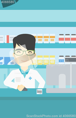 Image of Pharmacist at counter with cash box.