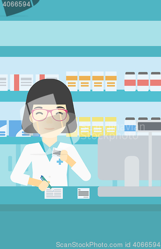 Image of Pharmacist writing prescription.