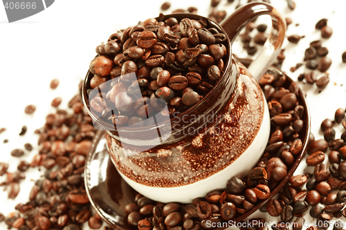 Image of Cup of coffee beans on white