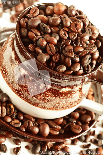 Image of Cup of coffee beans on white