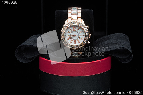 Image of gold watch isolated on black background