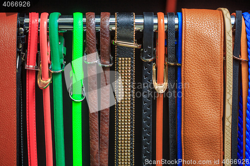 Image of Collection of Colorful  Belts on Rack 