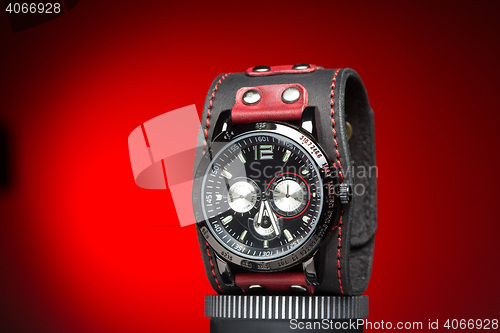 Image of men\'s watches with wide leather red bracelet 