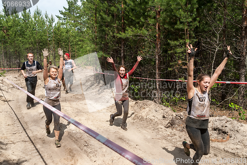 Image of Women run between stages in extrim race.Tyumen