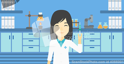 Image of Laboratory assistant with syringe in lab.