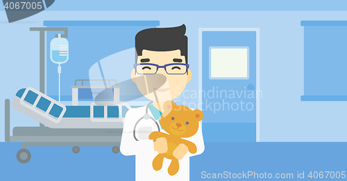 Image of Pediatrician doctor holding teddy bear.