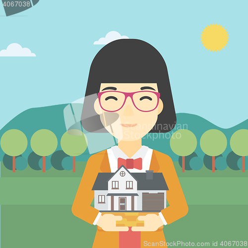 Image of Woman holding house model vector illustration.