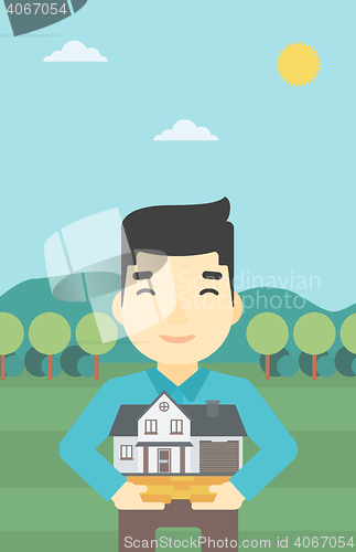 Image of Man holding house model vector illustration.