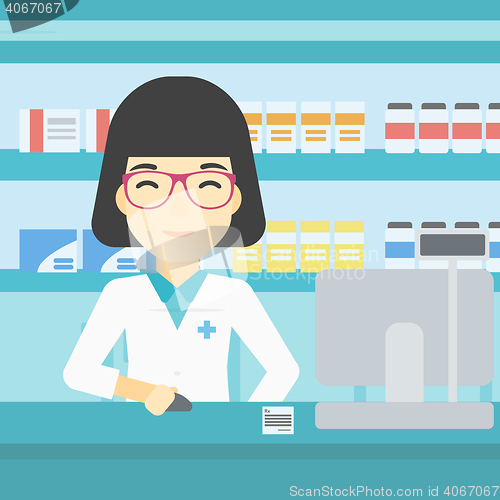 Image of Pharmacist at counter with computer monitor.