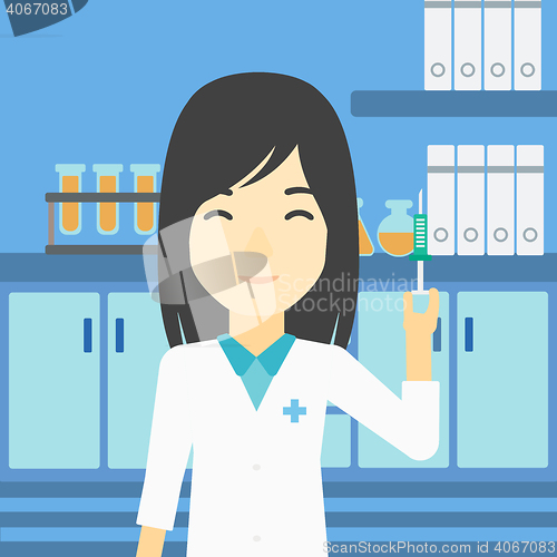 Image of Laboratory assistant with syringe in lab.