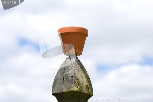 Image of Flower Pot On Fence Post