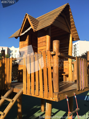 Image of wooden playground structure in city