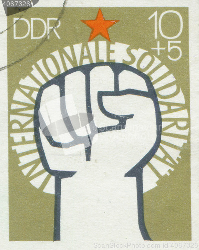 Image of 171e GERMANY - CIRCA 1972: A stamp printed in East Germany, showing of International Solidarity of Communists, circa 1972