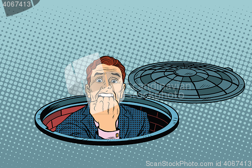 Image of scared retro man in the manhole