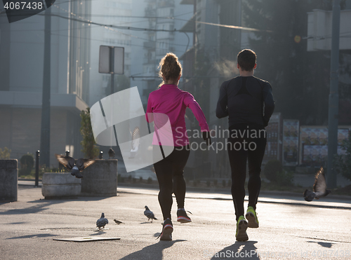 Image of young  couple jogging