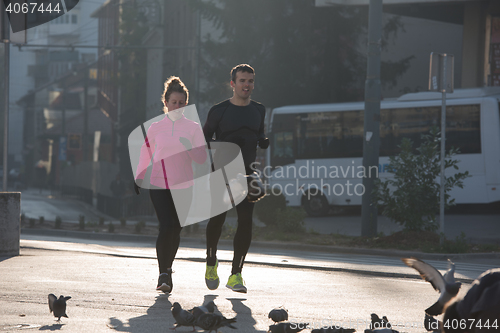 Image of young  couple jogging