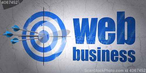 Image of Web development concept: target and Web Business on wall background