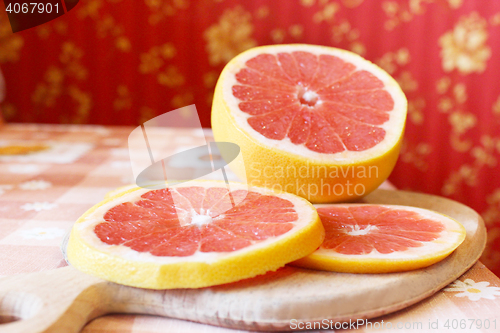 Image of grapefruit red cut by pieces